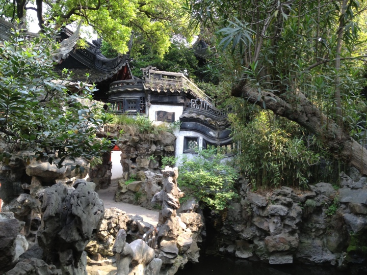 A Chinese garden has four elements: water, rocks, plants, and structures