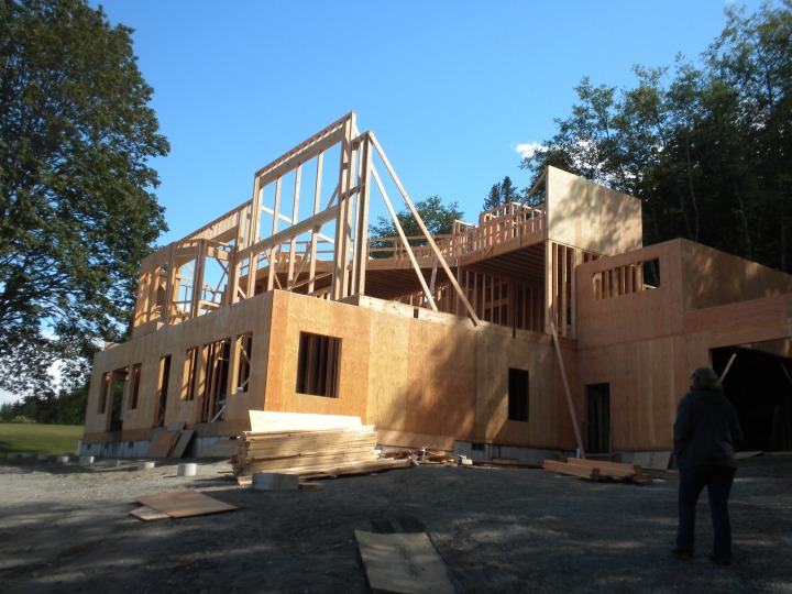 The house with framing in for the front living-room windows and the loft